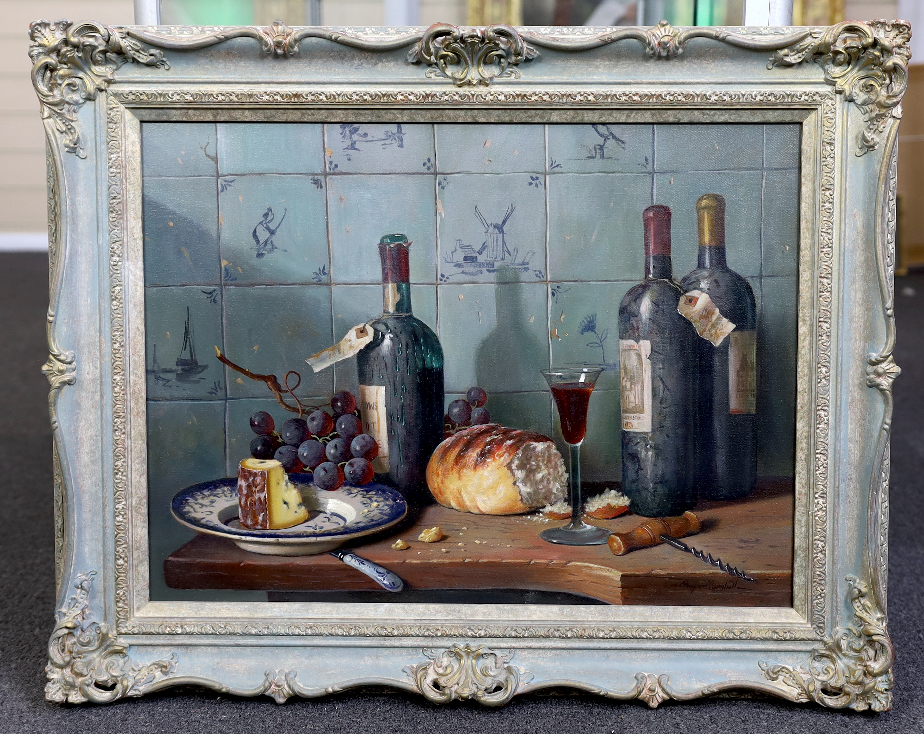 Raymond Campbell (English, b.1956), Still life of claret, cheese and grapes upon a ledge with delft tiles beyond, oil on canvas, 45 x 60cm